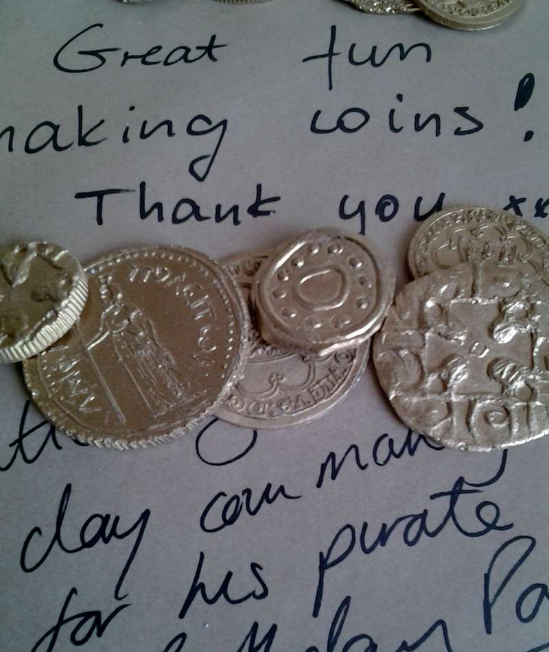 Laser cutting cardboard with Spanish Doubloon treasure designs