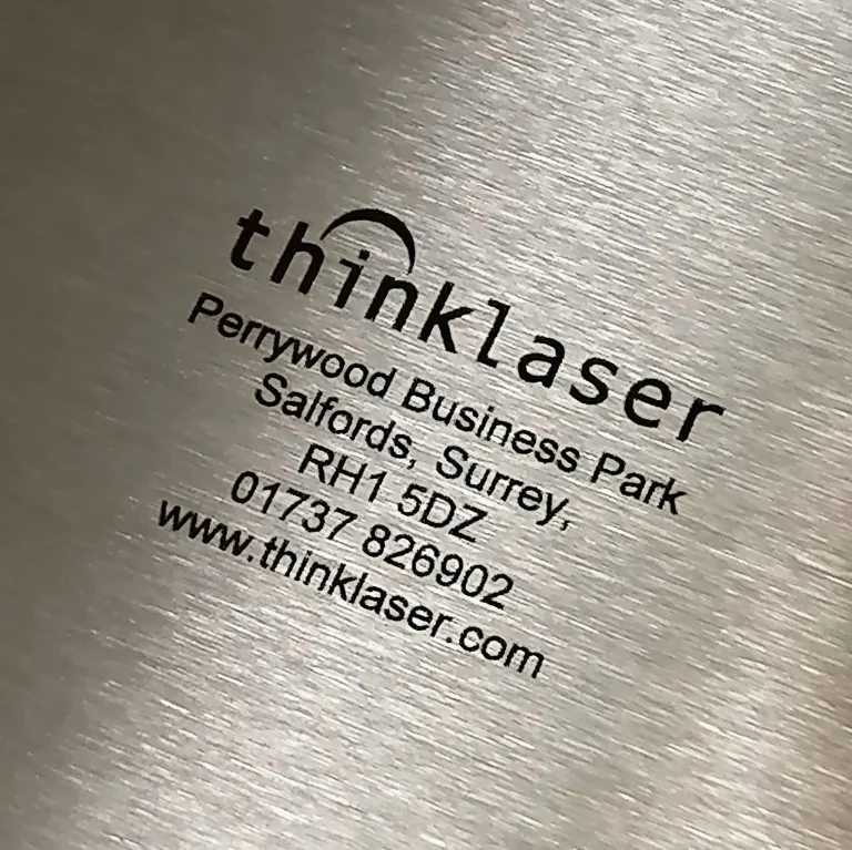 Black text laser engraved onto Stainless Steel Laser Engraving Marking Machines How to laser mark steel